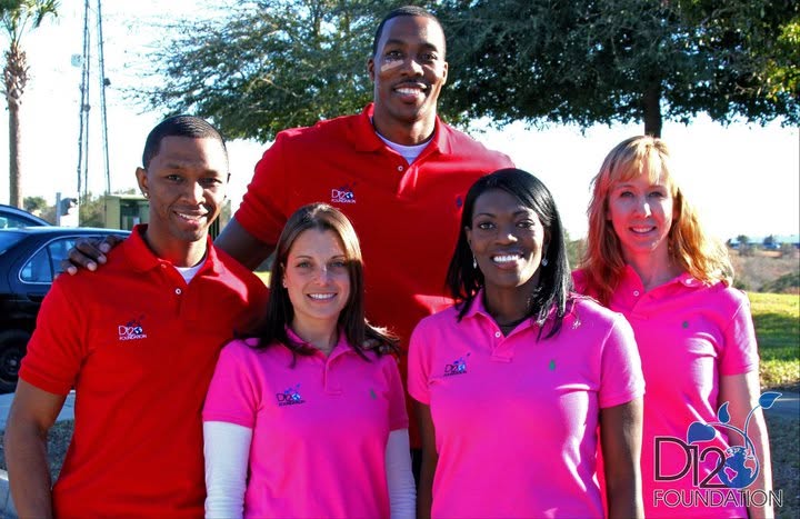 Tina J. Wheeler standing with members of the D12 Foundation team.