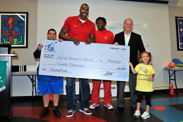 Representatives presenting a $20,000 charitable check benefiting Special Olympics Florida.