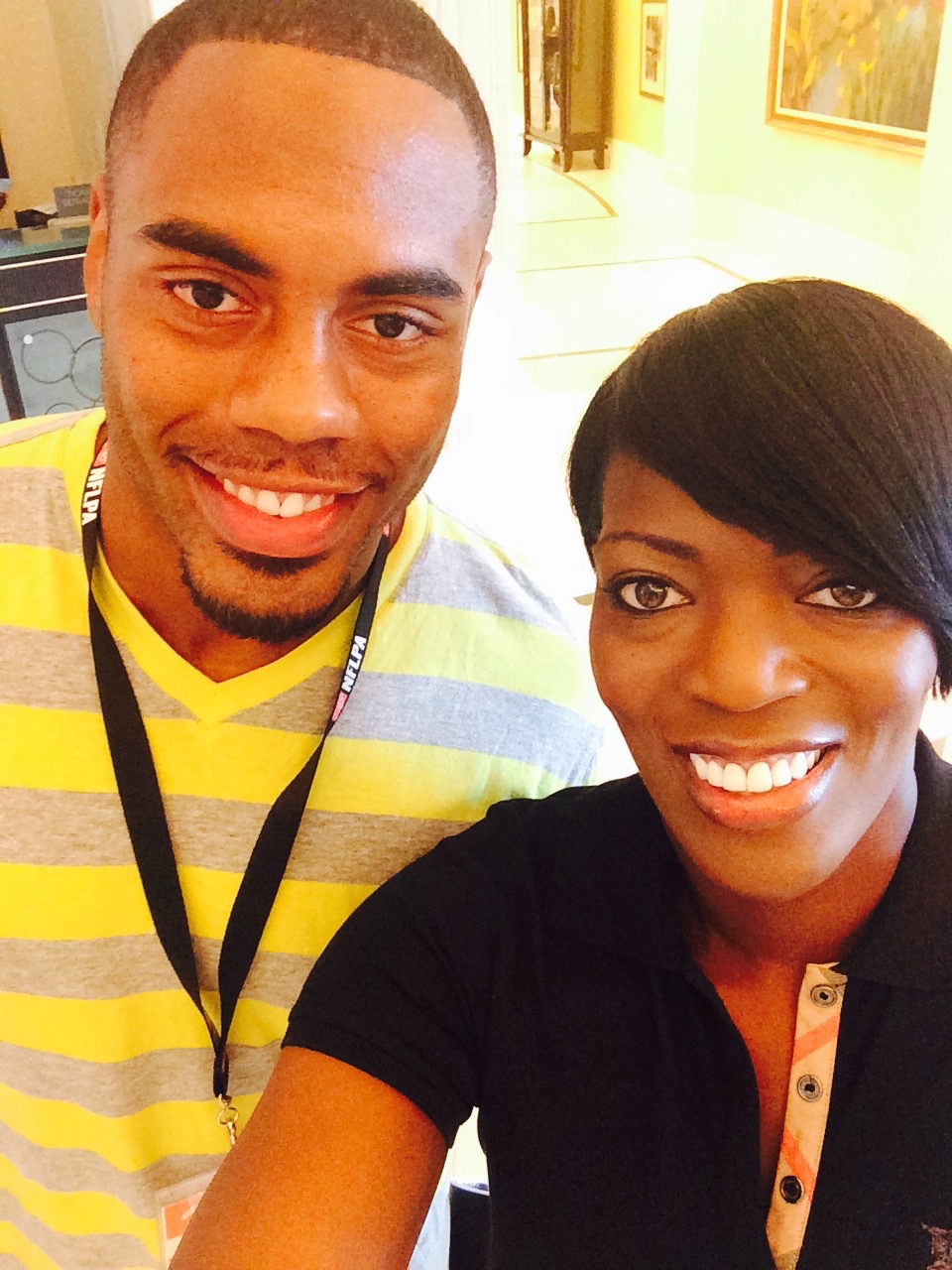 Tina J. Wheeler with former NFL player and Accion client Rashad Jennings.