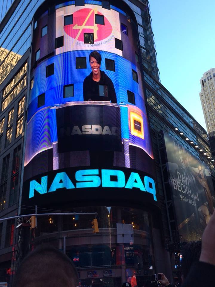 Tina J. Wheeler displayed on the NASDAQ MarketSite tower during a 2014 closing-bell event.